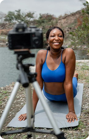 Creator recording fitness tutorial outdoors